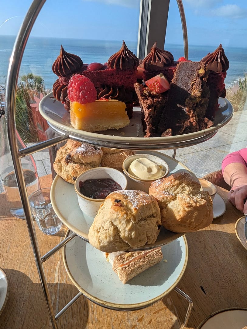 Afternoon tea selection of cakes, scones and sandwiches